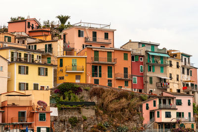Colorful buildings and old facade with windows in small village manarola cinque terre in liguria
