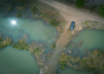 High angle view of lake amidst trees