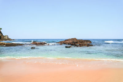 Scenic view of sea against clear sky