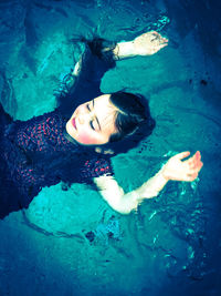 High angle view of woman swimming in pool