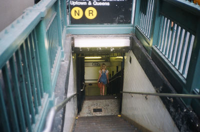 View of woman walking on tiled floor