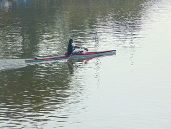 Man rowing boat in lake