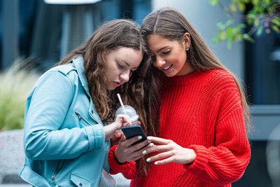 Young woman using mobile phone