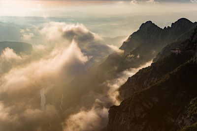 High section of rocky landscape and clouds