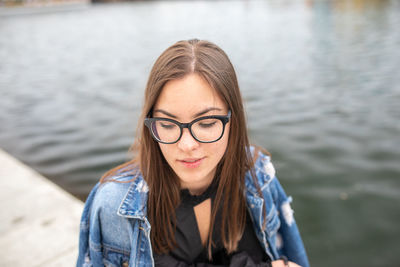 Portrait of young woman in lake