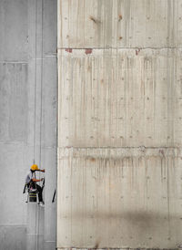 Directly above shot of worker working on wall