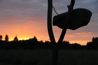 Scenic view of field against sky at sunset