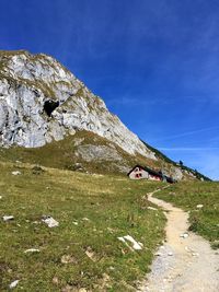 Rock formations on landscape against sky