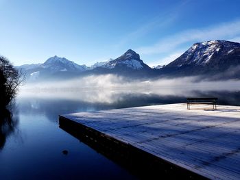 Scenic view of swimming pool by lake against sky