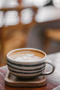 Close-up of coffee cup on table