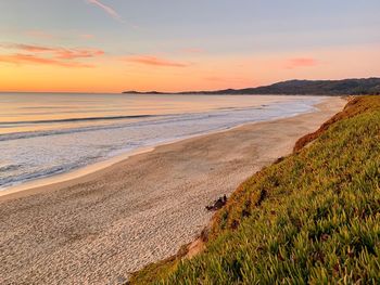 Scenic view of sea against sky during sunset