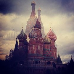 Low angle view of building against cloudy sky