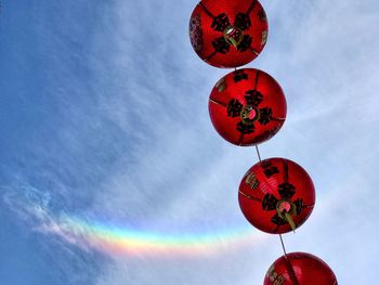 Low angle view of lantern hanging against sky