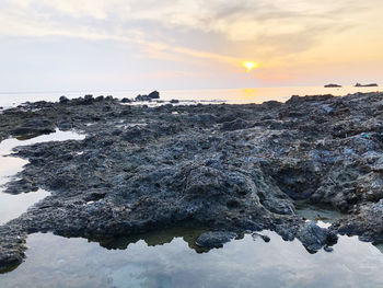 Scenic view of sea against sky during sunset