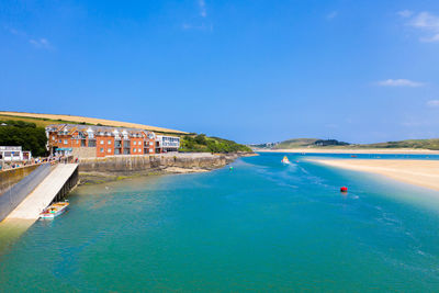 Scenic view of sea against buildings