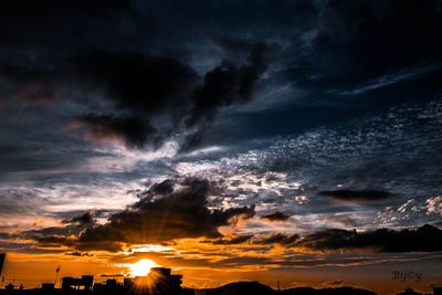 Scenic view of dramatic sky during sunset