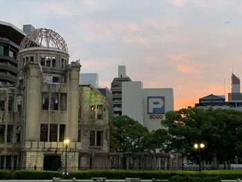 Low angle view of buildings against sky during sunset