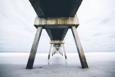 Low angle view of pier against sky