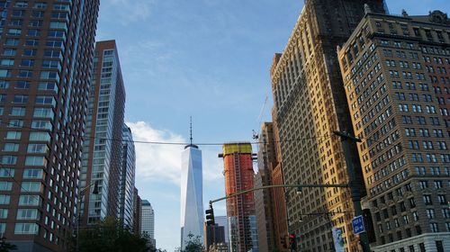 Low angle view of the world trade center building in new york city against sky