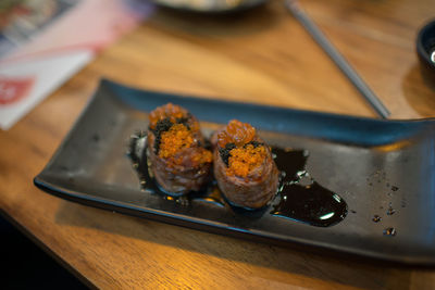 High angle view of meat in plate on table