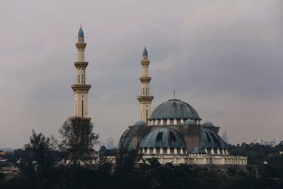 View of mosque against sky in city