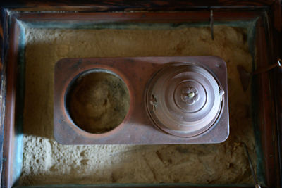 High angle view of old metal in container at home