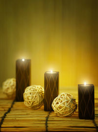 Close-up of illuminated lamp on table