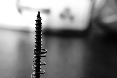 Close-up of spiral metal on table