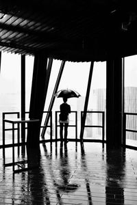 Silhouette boy standing in water