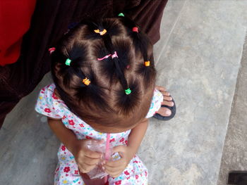 High angle view of girl holding woman