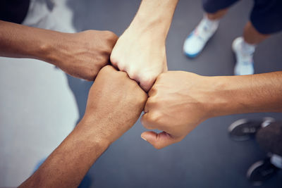 Low section of man holding hands