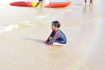 Full length of boy on beach