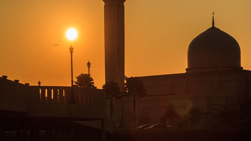 Silhouette cathedral against sky during sunset