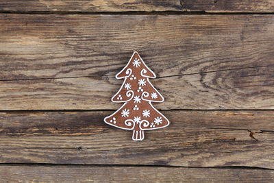 Close-up of christmas cookie on wooden table