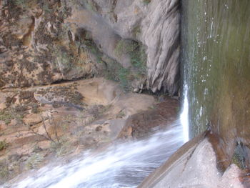 Scenic view of river flowing through rocks