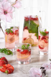 Summer strawberry cocktail or lemonade with basil. cold refreshing organic soft drink 