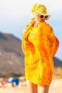 Close-up of woman standing at beach