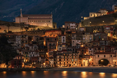 Illuminated buildings in city at night