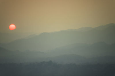 Scenic view of mountains against sky during sunset