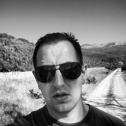 Portrait of young man wearing sunglasses