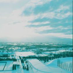 Scenic view of snow covered landscape against sky