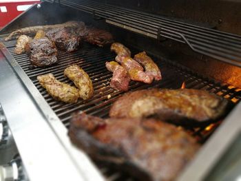 Close-up of meat on barbecue grill