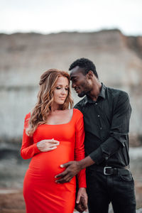 Young couple standing outdoors