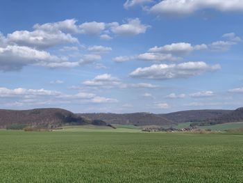 Scenic view of agricultural field against sky , in eichsfeld, thuringia, germany