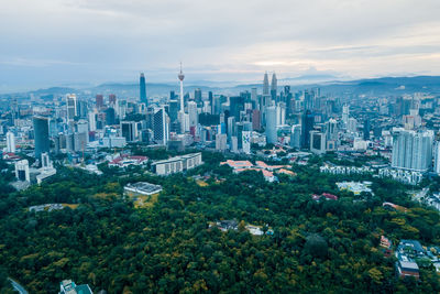 High angle view of buildings in city against sky