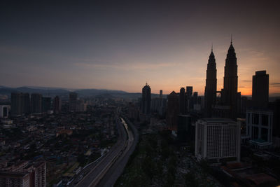 High angle view of city at sunset