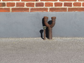 Close-up of pipe on wall