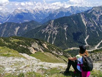 Rear view of woman looking at mountains