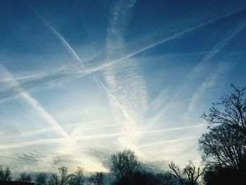 Low angle view of vapor trails in sky
