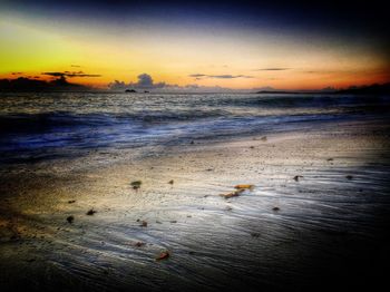 Scenic view of sea at sunset